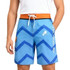 Knee-length men's swim shorts in blue with a zigzag pattern, featuring an orange waistband and a logo.