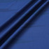 A close-up of blue polyester spandex fabric, showcasing its smooth texture and subtle patterns.