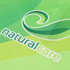 A green polo shirt featuring a swirling logo and the word "naturalcare" in white.