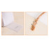 A textured white fabric strip with a logo, alongside a natural rope tied with a metal clip against a light surface.