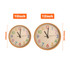Two round wall clocks with wood grain finish, displaying colourful numbers, in 10-inch and 12-inch sizes.
