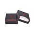 A mini tissue box in black with decorative red design, featuring an open and closed version. Includes branding.