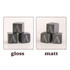 A set of black whiskey stones with engraved letters in gloss and matt finishes, shaped as square cubes.