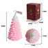 Cedar-shaped candles in pink, featuring a pine cone design, with a decorated gift box.