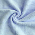 A light blue bamboo fiber towel, soft and plush, displayed in a spiralled layout, with visible texture.