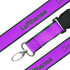 A purple woven lanyard with green edges featuring a clip for attaching items and a logo.