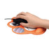 A paw-shaped orange mouse mat with circular images and a hand using a black mouse on it.