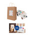 A kraft paper bag with twisted handles, featuring a decorative label, surrounded by decorative stickers.