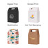 Die cut handle bags in various designs: black, white, patterned, and brown with branding on each. Paper construction.