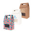 A set of three die cut handle bags in various colours: pink with patterns, white, and brown, each with a clear window.