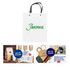 A white knitted handle bag with lamination, featuring a logo. The bag is nestled among various other promotional items.