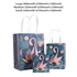 Three decorative bags in various sizes with a vibrant flamingo design and tropical foliage in shades of pink and green.