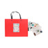 A red knitted handle bag with a black handle, accompanied by decorative stickers in various designs and colours.