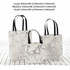 A set of three marble-patterned bags with black handles, in large, medium, and small sizes, featuring one logo.