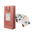 A drink bottle paper bag in rose gold with a floral design, accompanied by various decorative stickers.