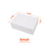 A small white foldable magnetic box with dimensions marked. It features a ribbon and has a logo.