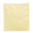 A reusable food pouch in a cheerful yellow with white polka dots and a zippered closure.