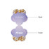 A floral-shaped sticky note pad featuring a pastel purple background with decorative golden and white balloons. It has a logo.