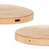 A bamboo wireless charger with a smooth, circular design and a USB-C port on the side. It has a natural wood finish.