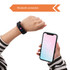 A black multifunctional smart band on a wrist, paired with a smartphone displaying a weather app.