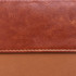 A brown RFID PU leather passport holder with a textured finish and stitched detailing. Features a logo.