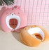A pink and orange tiger-shaped 2-in-1 travel pillow, featuring plush textures and cute facial details.