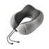 A grey memory foam U-shaped travel pillow with a textured inner lining and a drawstring closure.