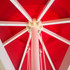 A red 3x3m square market umbrella featuring a white frame and inner canopy structure. It has a central pole and ropes.
