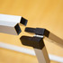A-frame banner stand with a metallic silver finish and black connectors, designed for easy assembly.