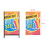 A metal A-frame sign with a colourful design featuring gifts and promotional text. It has a logo on the top.