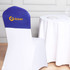 A half chair cover in blue and white featuring a logo, placed on a chair next to a table with a white tablecloth.