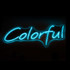 A neon LED sign featuring the word "Colourful" in bright blue light against a dark background.