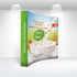Curved fabric popup display featuring a vibrant design with a cup of milk and grains, predominantly green and white.