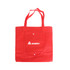 A red non-woven foldable bag with two handles and a pocket. It features a logo on the front.