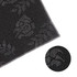A black plush logo mat featuring a subtle rose pattern, bordered with a stitched edge. It includes a logo.