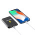 A black 5000mAh eco magnetic power bank connected to a smartphone via a cable, with a logo visible on the power bank.