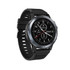 A round smart watch with a black strap and silver casing, featuring a digital display with various watch faces.