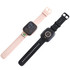 A square smart watch in pink and black, featuring a digital display and silicone straps. Includes a logo on the pink band.