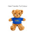 A brown plush bear wearing a blue shirt with a logo, sitting upright. The bear has shiny black eyes.