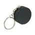 A black hockey puck stress reliever attached to a keyring with a silver chain.