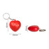 A red heart-shaped stress reliever with a keyring attached, featuring white branding.