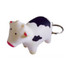 A keyring featuring a white and black cow stress reliever with a silver keyring attachment.