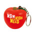 A red apple-shaped stress reliever with a keyring attachment. The apple features a green leaf and a logo.