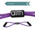 A Figure 8 resistance band with handles in purple, featuring a logo on the central strap.