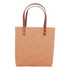 A washable kraft paper bag in a natural brown colour with brown PU handles. It features silver hardware accents.
