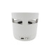 A white cylindrical Bluetooth speaker with a wireless charging base, featuring a USB port and an on/off switch.