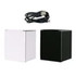 A black and a white Bluetooth speaker with a wireless charger, accompanied by a charging cable.