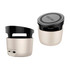 A two-tone beige and black Bluetooth speaker with a wireless charging top and a logo on the lid.