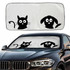 A foldable car shade featuring black silhouettes of a cat and dog on a light background, fitting over a vehicle's windshield.