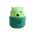 A green dog treat dispenser toy shaped like a bear, featuring a smiling face and a circular base. It has a logo on top.